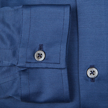 A close up of a contemporary man wearing a Canali Indigo Blue Cotton Jersey Casual Shirt with buttons.