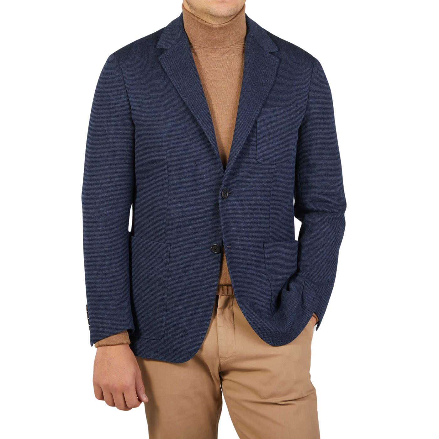 A man dressed in casual tailoring with a Canali Navy Blue Melange Wool Jersey Jacket and tan turtleneck.