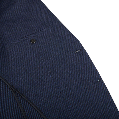A close up of a Canali Navy Blue Melange Wool Jersey Jacket with a zipper, showcasing casual tailoring.