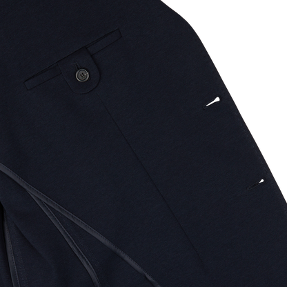 Close-up of a Canali Navy Cotton Jersey Unconstructed Blazer with button and pocket details.