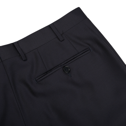 The back pocket of Canali navy blue wool twill formal trousers, made from navy blue wool twill fabric.