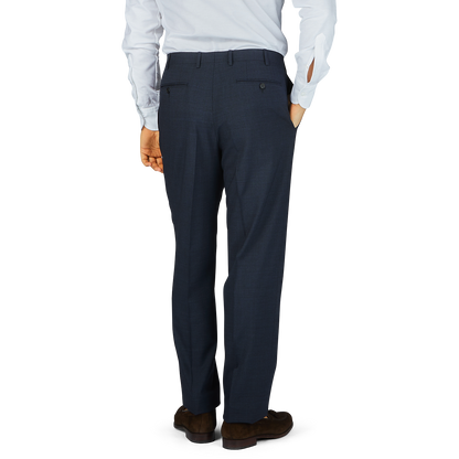 A man wearing a blue Canali suit and Navy Puppytooth Wool Stretch Flat Front Trousers.
