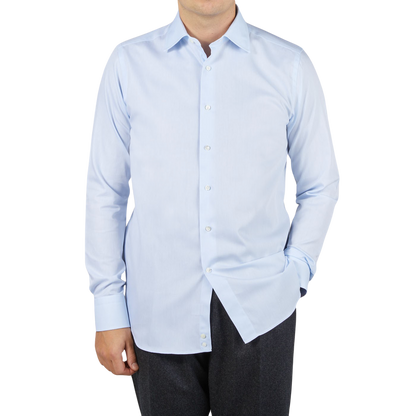 A man wearing a Canali shirt in sky blue dressed.