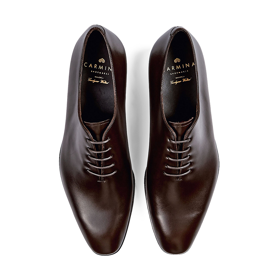 A pair of polished Carmina Brown Calf Leather Rain Wholecut Oxfords.