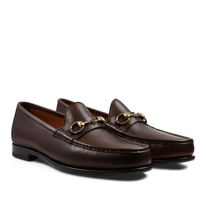 A pair of Brown Funchal Leather Xim Horsebit loafers crafted by skilled craftsmen with gold-tone metal horsebit detail by Carmina.