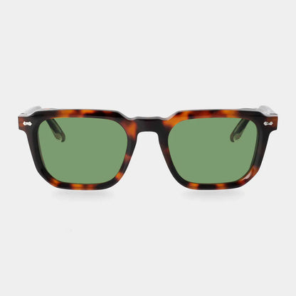 Front view of TBD Eyewear’s Dart Brown Havana | Green sunglasses, featuring bold tortoiseshell recyclable acetate frames with silver hinge accents and green mineral glass lenses, set against a plain white background. , available at Richard Gelding Mayfair