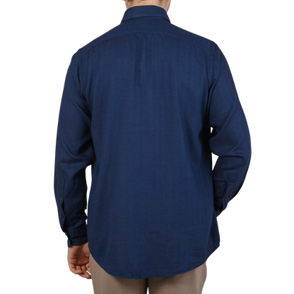The back view of a man wearing a dark blue Eton Dark Blue Cotton Tencel Contemporary Shirt.