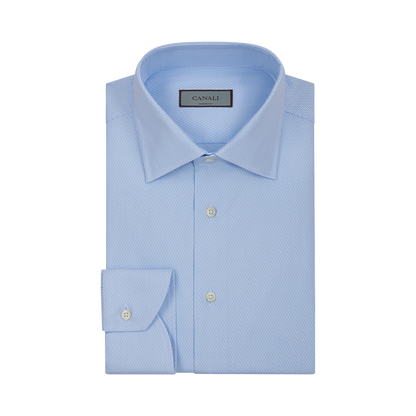 The Canali Sky Blue Cotton Textured Shirt features a classic collar, long sleeves with buttoned cuffs, white front buttons, and a subtle textured pattern. Displayed on a plain white background. , available at Richard Gelding Mayfair