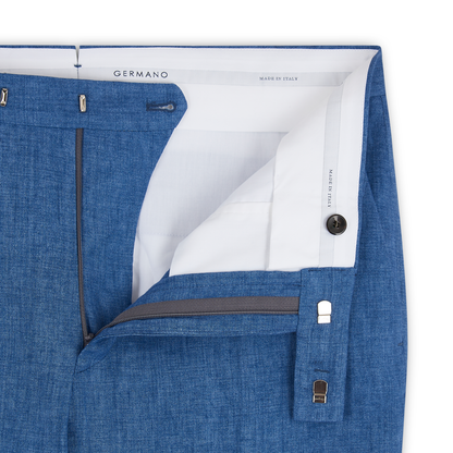 Close-up of Germano Blue Linen Formal Trousers with open waistband showing white lining, button, zip fly, and hook-and-bar closure. "Germano" label and "Made in Italy" are visible inside. , available at Richard Gelding Mayfair