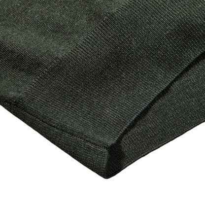 Close-up of a Fedeli Green 140s Wool Mockneck Sweater.