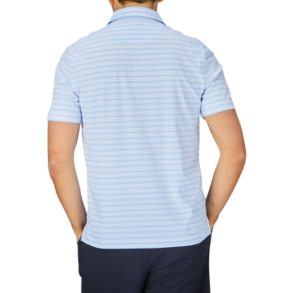 Man standing with his back to the camera wearing a Fedeli Blue Multi Striped Cotton Jersey Polo Shirt.