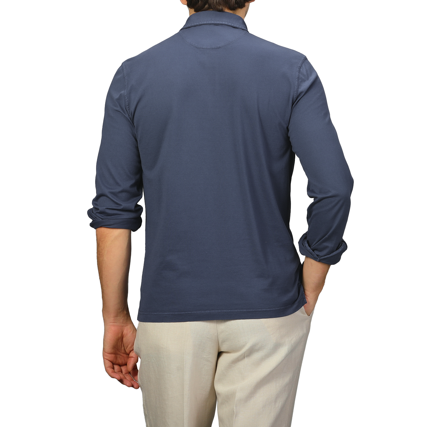 A person wearing Fedeli's Dark Blue Organic Cotton LS Polo Shirt and beige pants is shown from the back against a neutral backdrop.