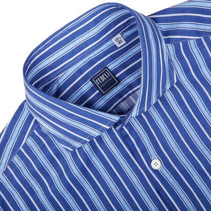 Close-up of a dark blue striped men's slim fit dress shirt with a label showing the brand 'Fedeli'.