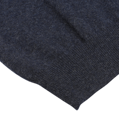 Close-up image of the Dark Blue Wool Cashmere 1/4 Zip Sweater by Fedeli, showcasing its textured fabric and detailed stitching.