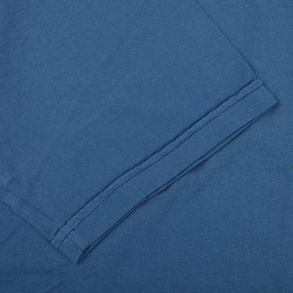 A close up of a luxury Fedeli Indigo Blue Organic Cotton T-shirt.