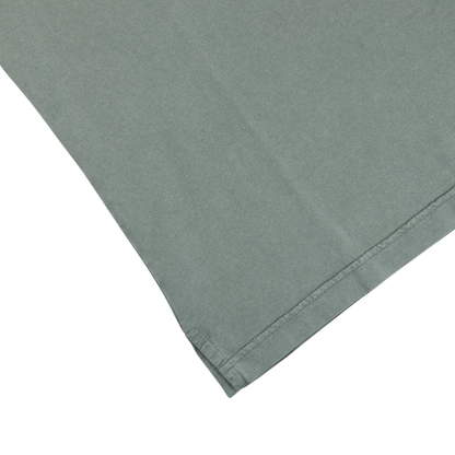 A Fedeli Olive Green Organic Cotton Polo Shirt on a white surface.