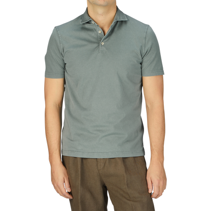 A man in a Fedeli Olive Green Organic Cotton Polo Shirt.