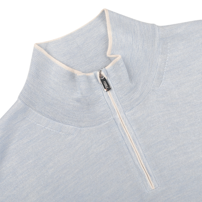 Close-up of the Sky Blue Cashmere Silk 1/4 Zip Sweater by Fedeli, showcasing its quarter-zip design and stand-up collar.