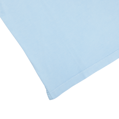 A luxury Sky Blue Organic Cotton Polo Shirt by Fedeli on a white surface.
