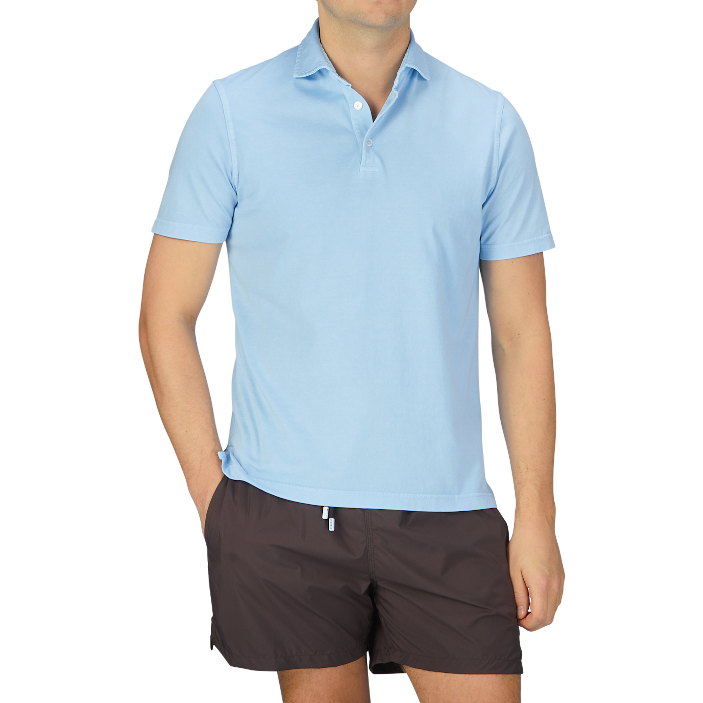 A man wearing a luxury Fedeli Sky Blue Organic Cotton Polo Shirt.