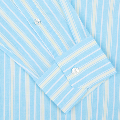 A close-up view of a Fedeli Sky Blue Yellow Striped Cotton Beach Shirt with a focus on the cuff and buttons.