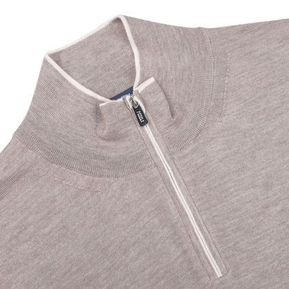 Fedeli's Taupe Beige Cashmere Silk 1/4 Zip Sweater combines luxury with a cozy cashmere-silk blend, featuring a high collar and elegant white piping around the zipper.