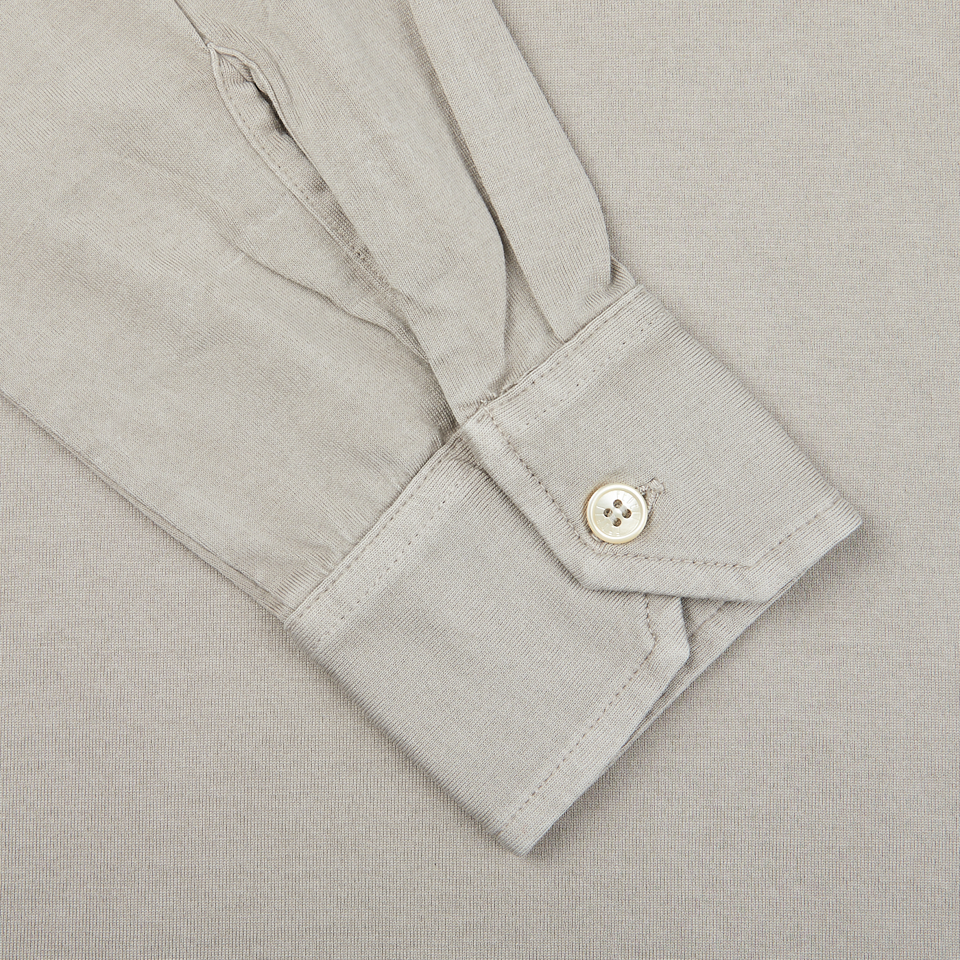 A close up of a Fedeli Taupe Beige Organic Cotton LS Polo Shirt with buttons.