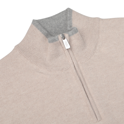 Close-up view of the Fedeli Taupe Beige Wool Cashmere 1/4 Zip Sweater, featuring a luxurious blend of wool and cashmere, a quarter-zip collar, and grey ribbed trim at the neckline—perfect as a versatile layering piece.