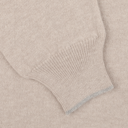Close-up of the Fedeli Taupe Beige Wool Cashmere 1/4 Zip Sweater sleeve, showcasing the ribbed cuff detail – perfect as a layering piece.