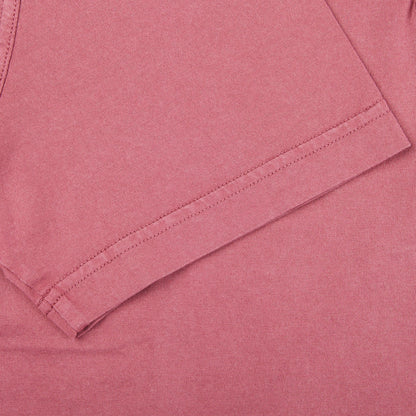 A close up of a Fedeli Washed Raspberry Organic Cotton Polo Shirt.
