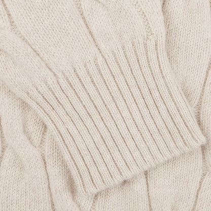 Close-up of the Filippo de Laurentiis Cream Wool Cashmere Cableknit Button Cardigan featuring a ribbed cuff and button closure.