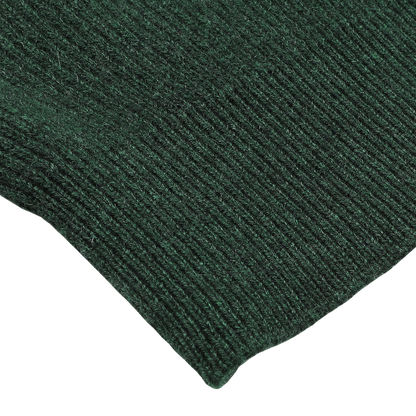 Close-up of the Bottle Green Cashmere Rib Knit Cardigan by Filippo de Laurentiis, showcasing its dark green rib-knitted fabric with visible stitching detail.