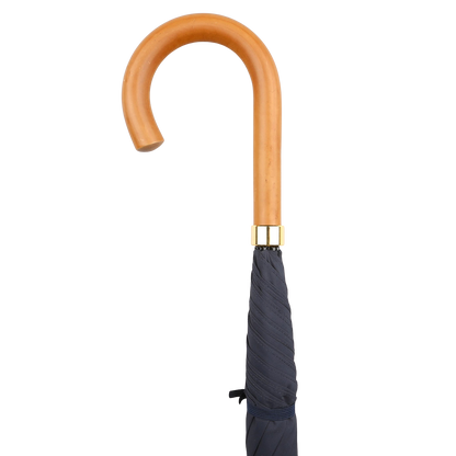 A Fox Umbrellas' navy blue packable umbrella with a Malacca crook handle, accented in gold, handmade in England, set against a white background.