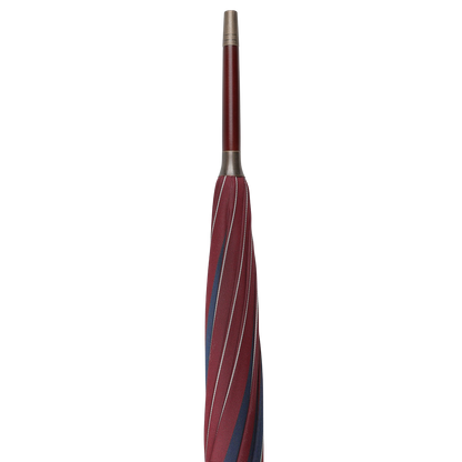 A Red Blue Striped Maple Handle Umbrella by Fox Umbrellas, made by hand, positioned vertically with a closed canopy and a straight handle.