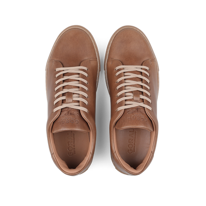 Goral's Brown Horween Leather Mellor II Sneakers feature premium-quality brown leather and white laces, presented from an overhead view.