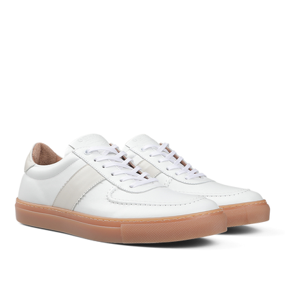Goral's White Leather Hadfield Sneakers boast a classic German military trainer style, complete with tan rubber soles, white laces, and intricate stitching details.
