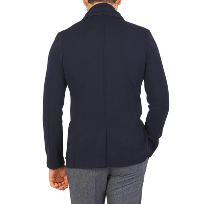 The back view of a Gran Sasso Teflon-coated man wearing a Navy Blue Rain Wool Knitted Jacket.