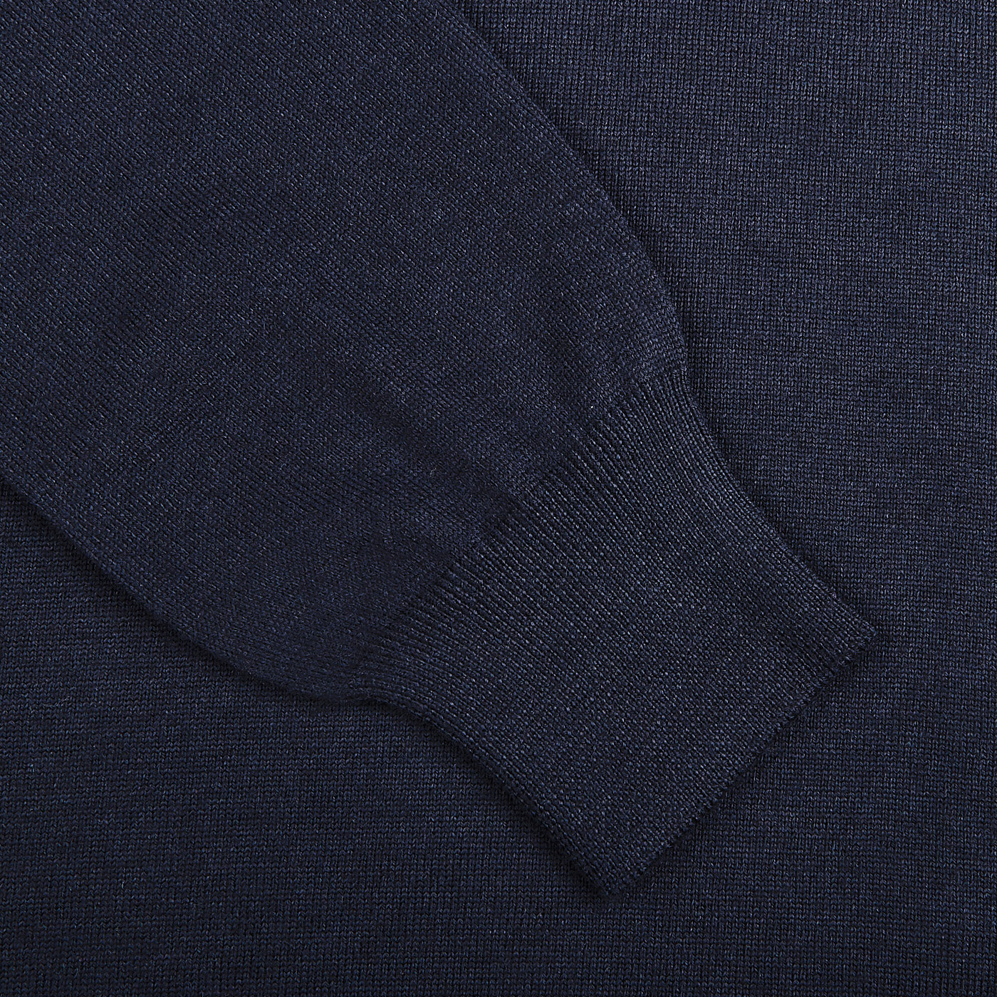 Close-up of the Gran Sasso Navy Blue Extra Fine Merino Wool Rollneck, highlighting the ribbed cuff and textured fabric of this slim fit sweater.