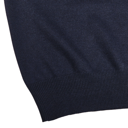 Close-up of the lower part of the Gran Sasso Navy Blue Extra Fine Merino Wool Rollneck, showcasing its slim fit and ribbed hem detail against a white background.