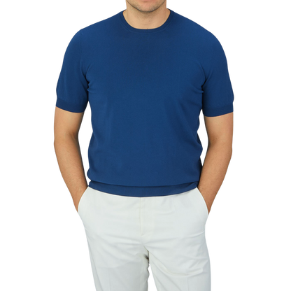 A man wearing a lightweight Indigo Blue Knitted Organic Cotton T-Shirt by Gran Sasso.