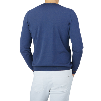 The back view of a man wearing a Gran Sasso Dark Blue Silk Cotton Crewneck Sweater.
