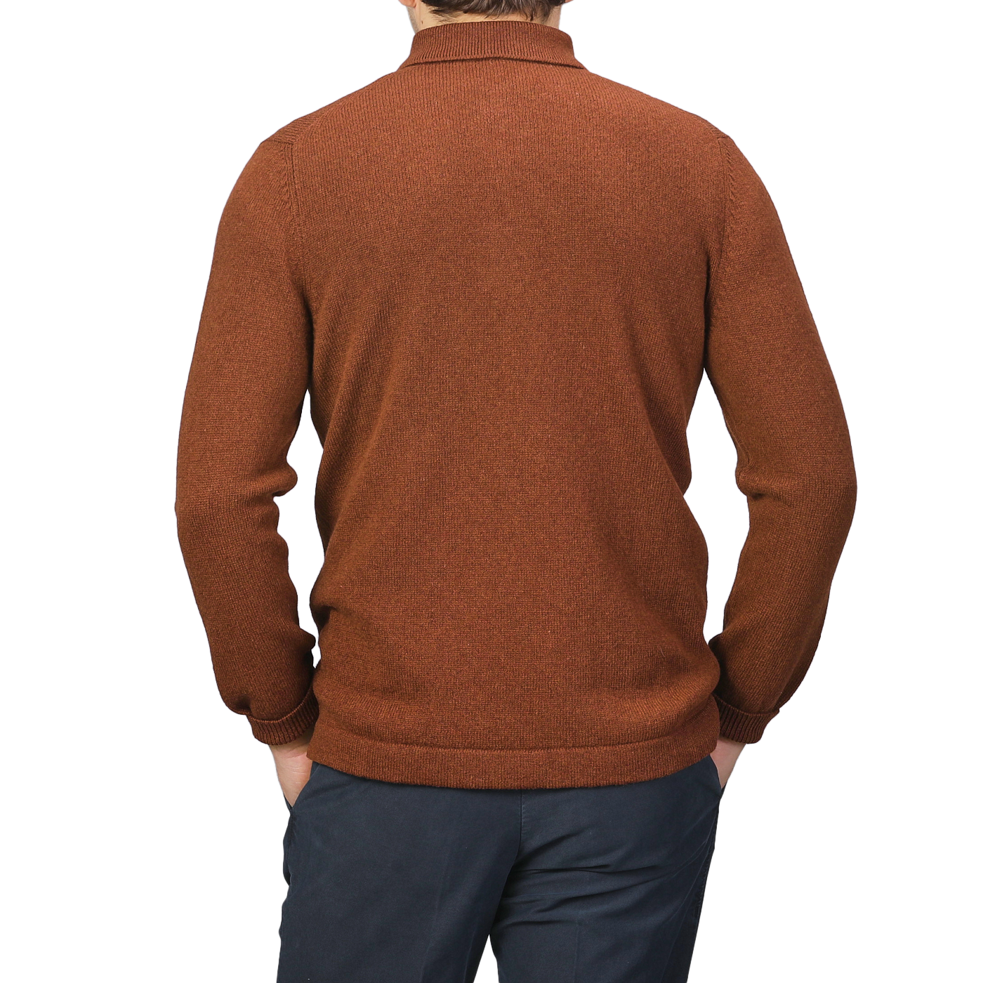 A person is seen from the back against a plain background, wearing a Burnt Orange Virgin Wool LS Polo Shirt by Gran Sasso paired with dark pants.