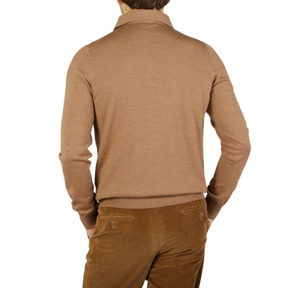 The back view of a man wearing a Gran Sasso Camel Merino Wool One-Piece Collar Polo Shirt.