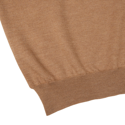 A close up of a Gran Sasso Camel Merino Wool One-Piece Collar Polo Shirt.