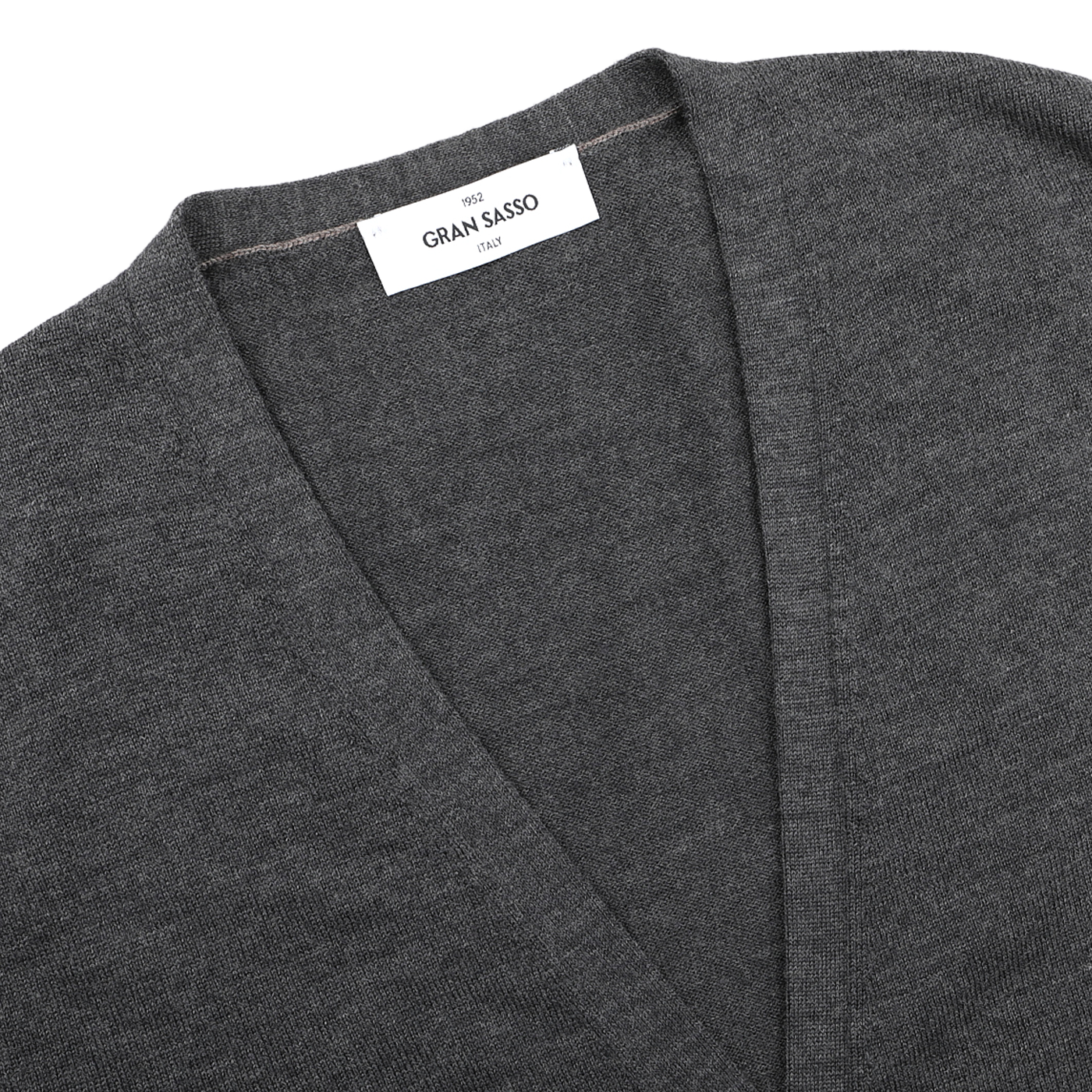 Close-up of a charcoal Extra Fine Merino Wool Vest by Gran Sasso, showing the brand label sewn inside the collar.