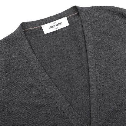 Close-up of a charcoal Extra Fine Merino Wool Vest by Gran Sasso, showing the brand label sewn inside the collar.