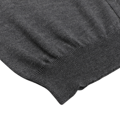 Close-up of the hem and lower part of the Gran Sasso Charcoal Extra Fine Merino Wool Vest, laid flat on a white background.