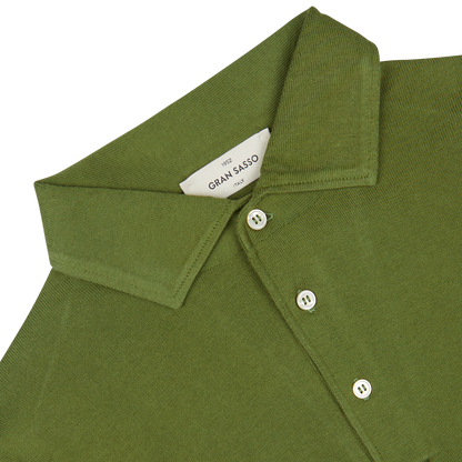 Close-up of a green Gran Sasso Green Organic Cotton LS Polo Shirt showing detail of the collar and buttons.
