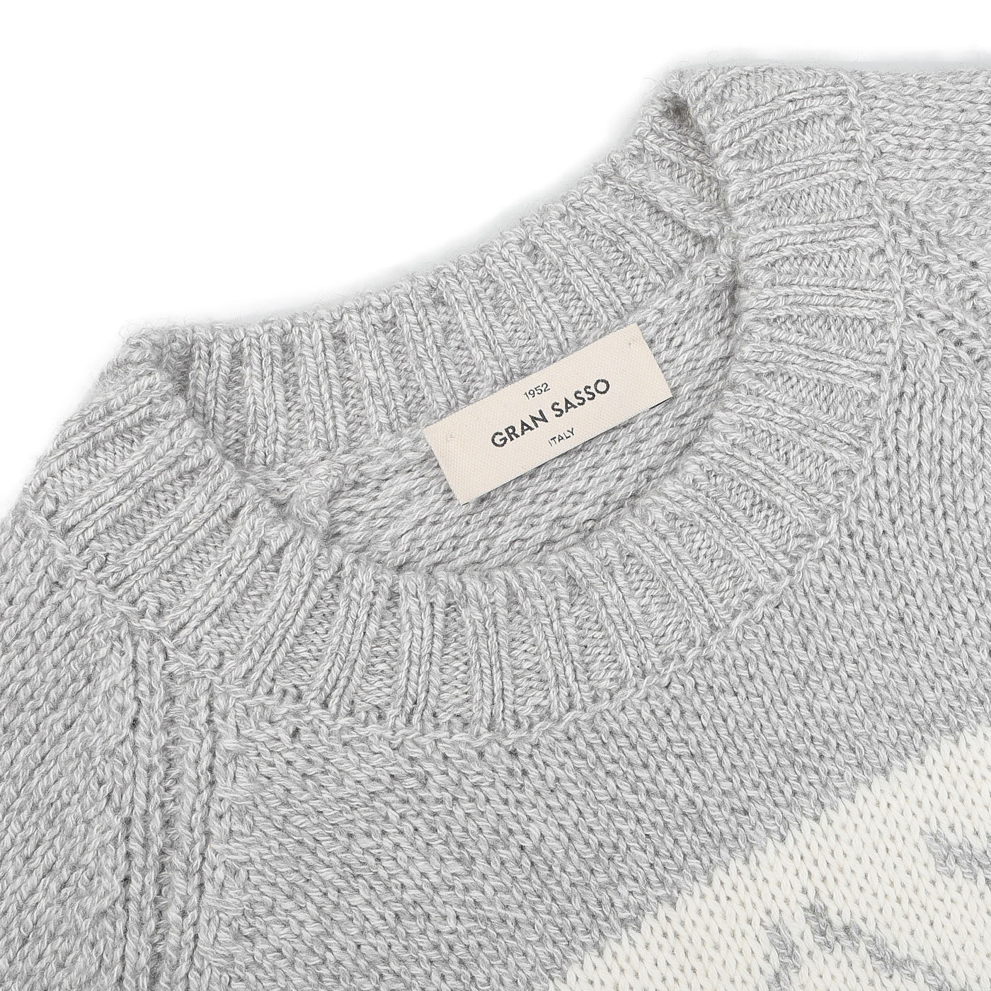 Close-up of the Grey Eco Cashmere Norwegian Crewneck Sweater featuring a ribbed neckline, complete with a "Gran Sasso" label sewn at the back of the collar, highlighting its exquisite design.