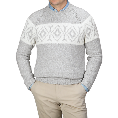 A person wearing a Gran Sasso Grey Eco Cashmere Norwegian Crewneck Sweater paired with beige pants.